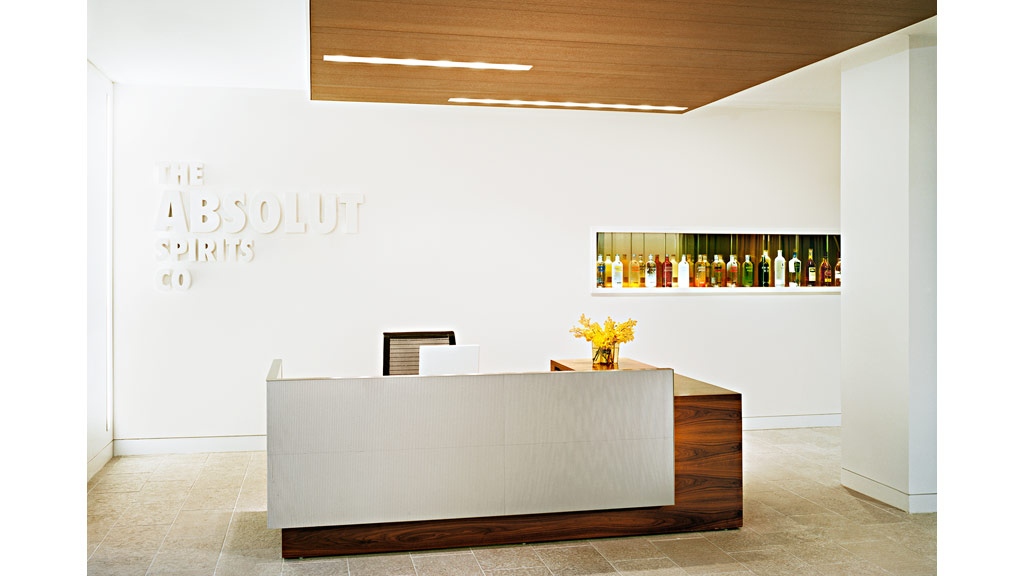 A table with a shelf of wine.