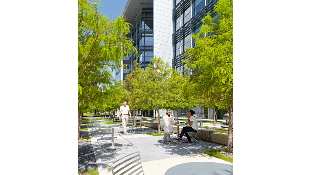 A few people sitting on a bench.