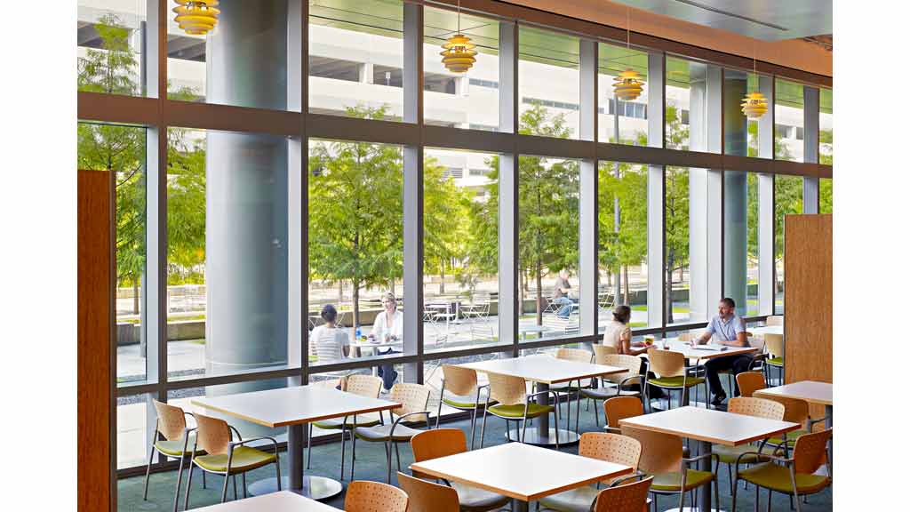 A group of people sitting at tables.