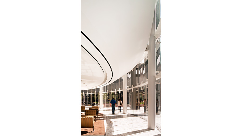 A building with a few people walking.