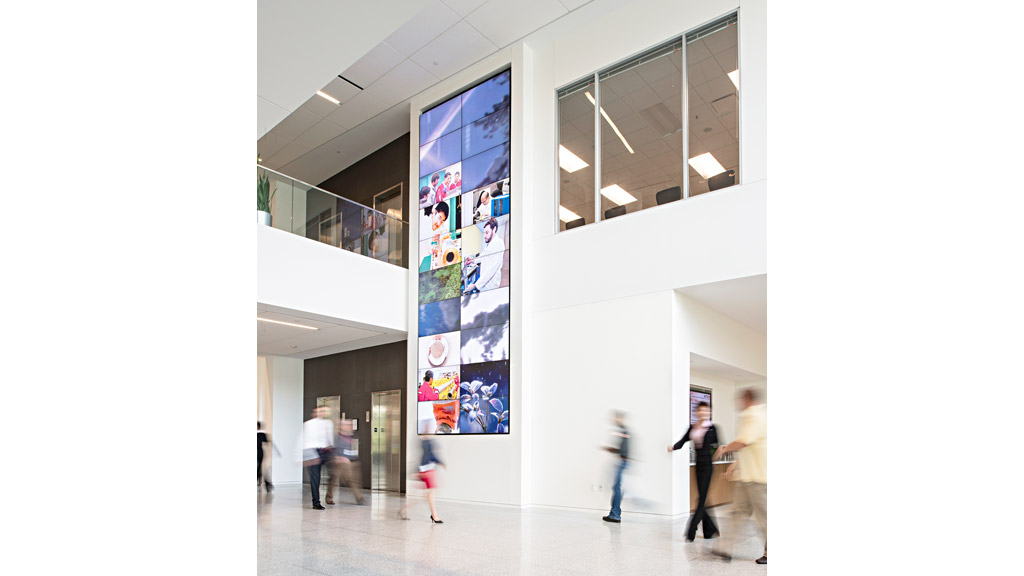 A group of people walking in a building.