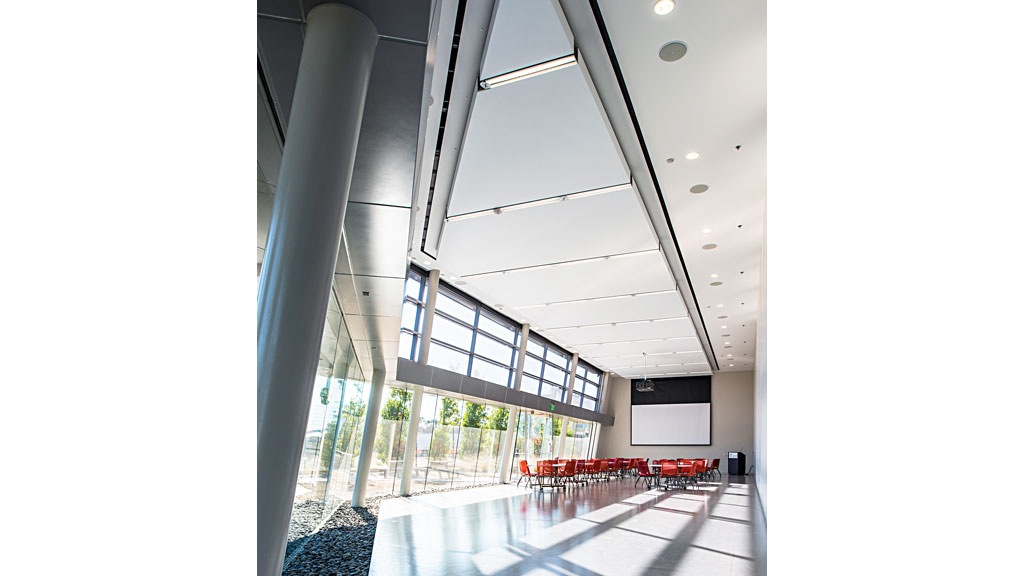 A large room with a large glass ceiling and a large window.