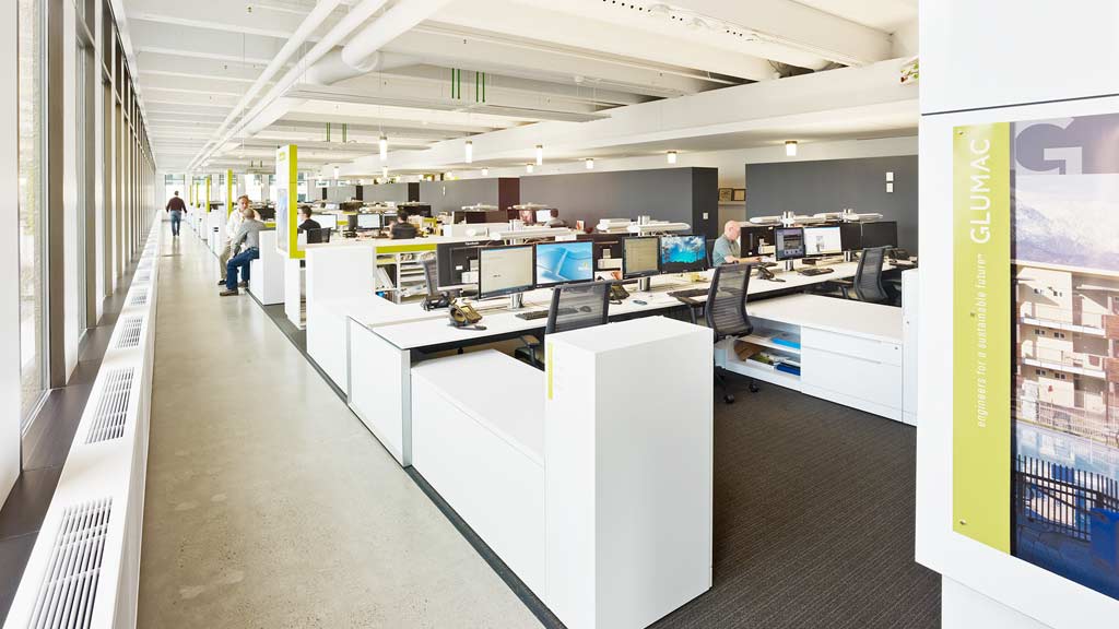 A long hallway with computers.