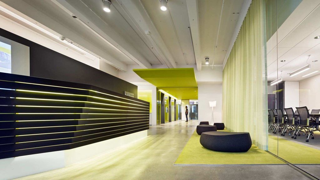 A long hallway with a person walking.