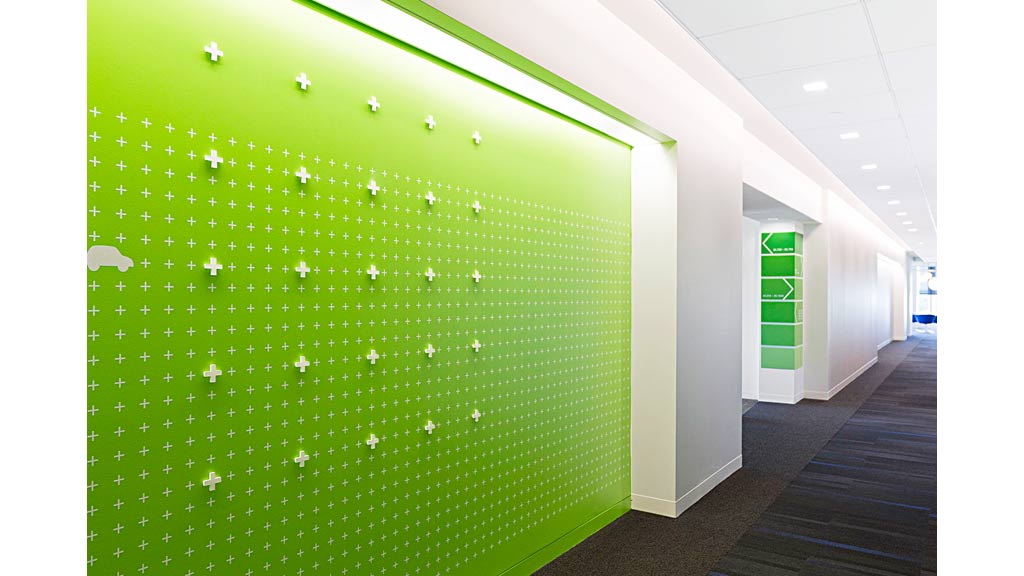 A hallway with green walls.