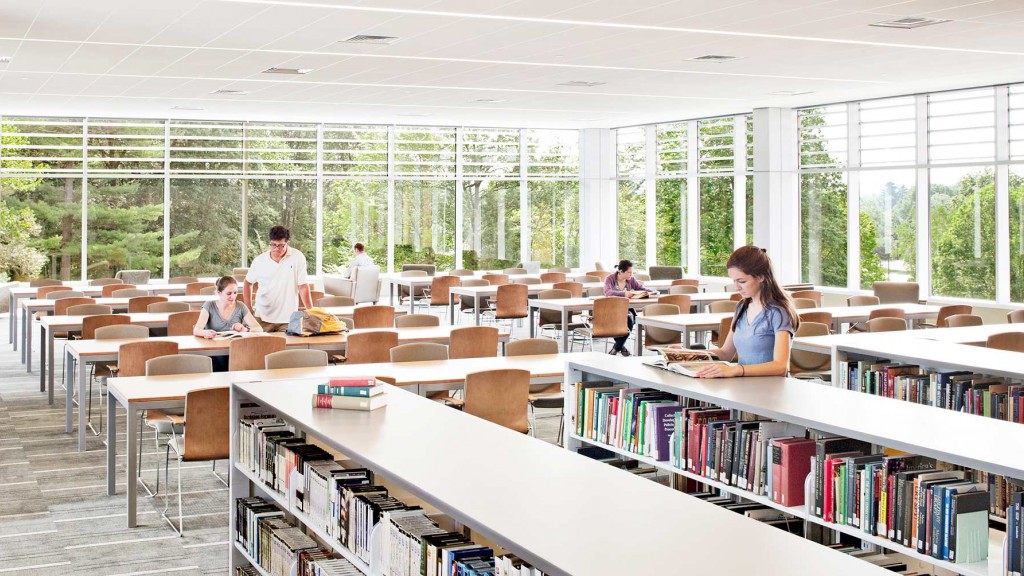 A group of people in a library.