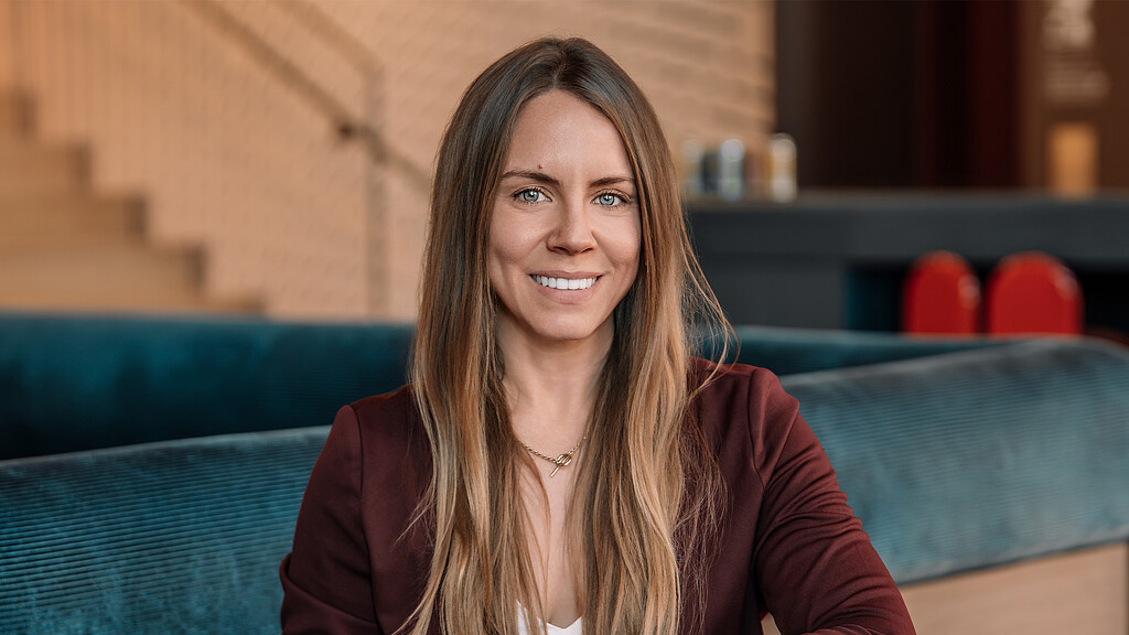 A woman smiling at the camera.