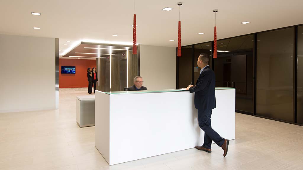 A person standing at a counter.