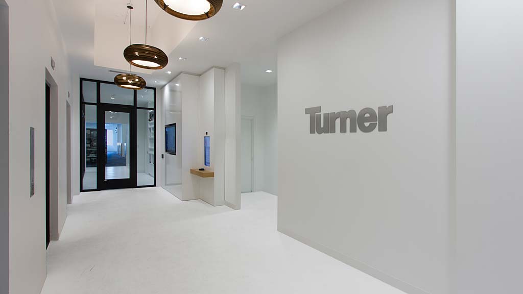 A hallway with white walls.