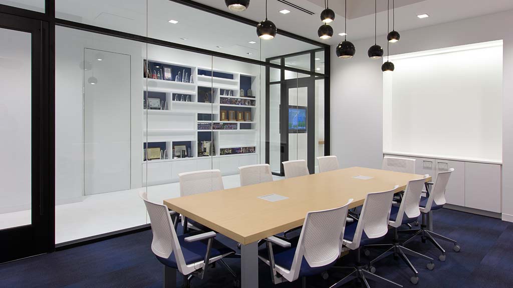 A room with a table and chairs.