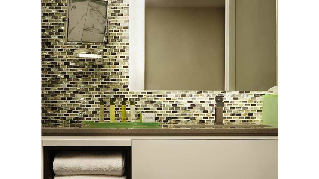 A counter top with a clock on it.