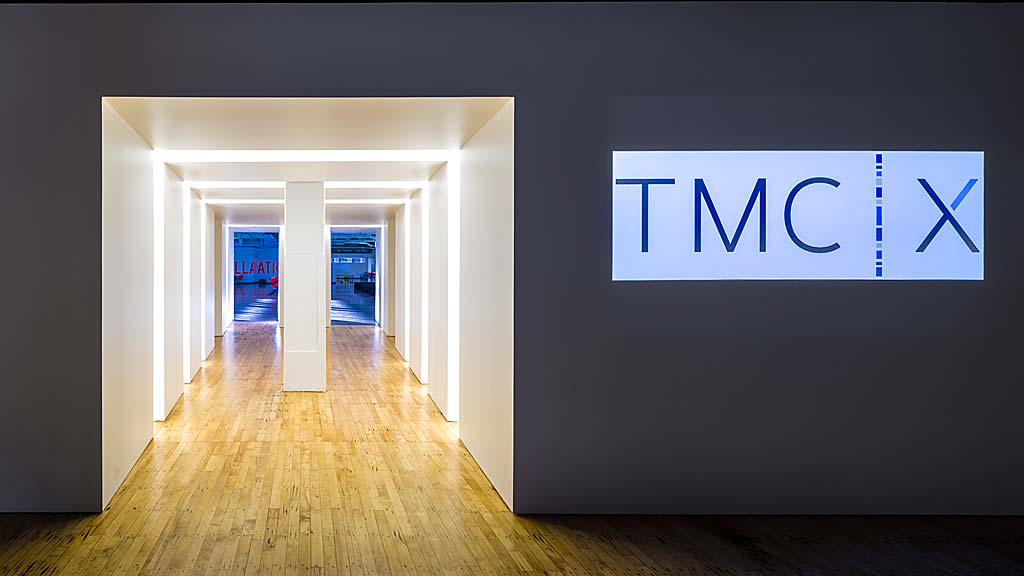 A hallway with white walls.