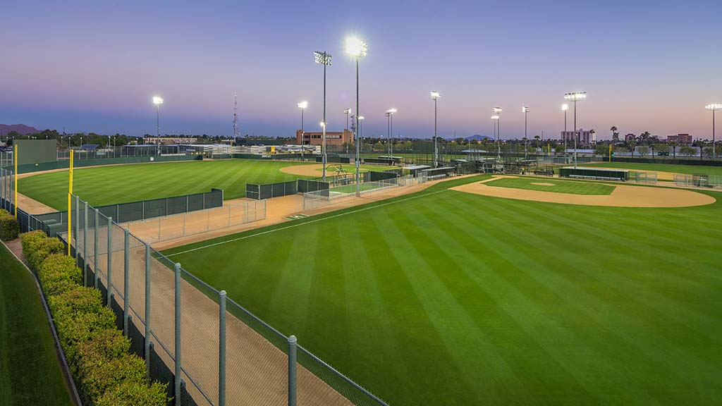 A sports field with a fence.