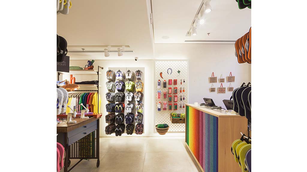 A room with a wall of shoes.