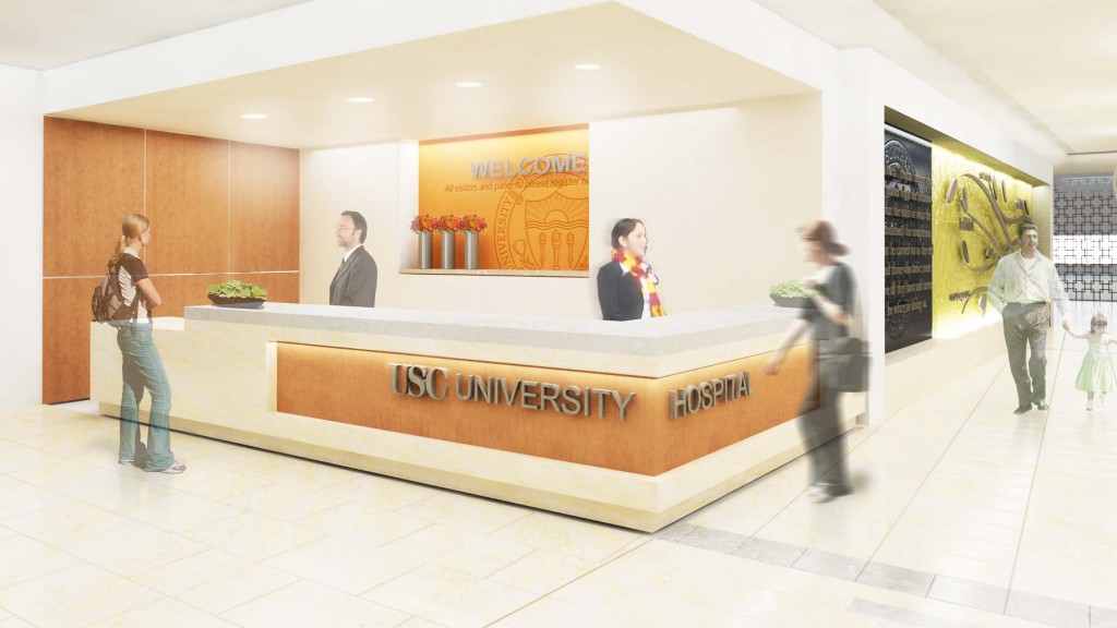 A group of people standing around a display.