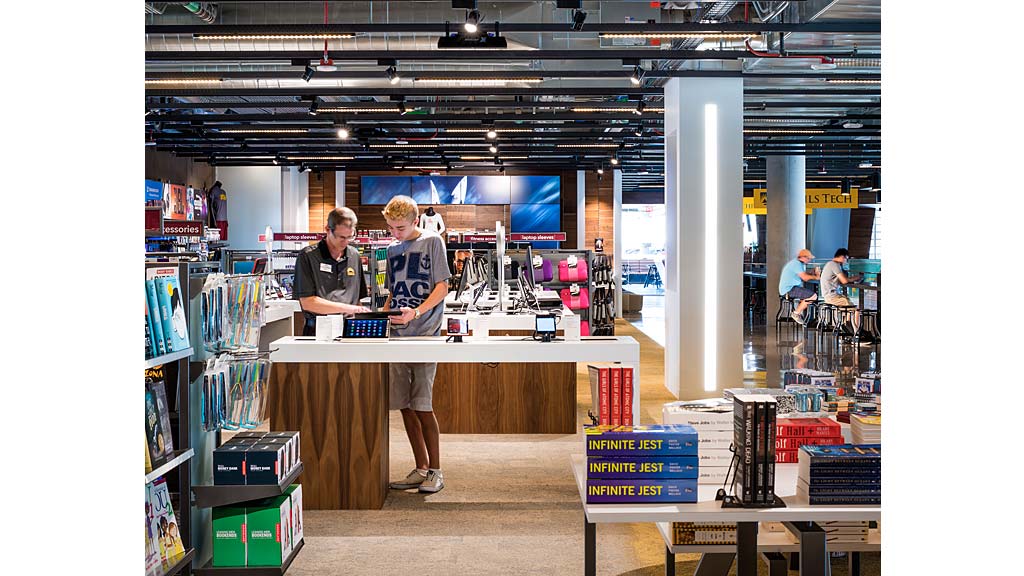 A couple of men in a store.