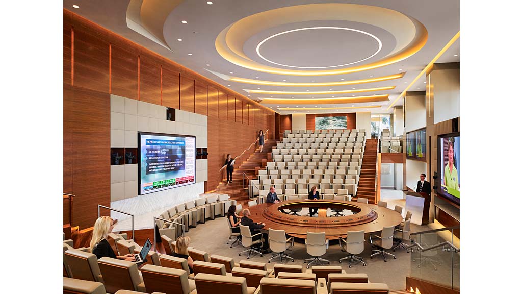 A room with a stage and chairs.