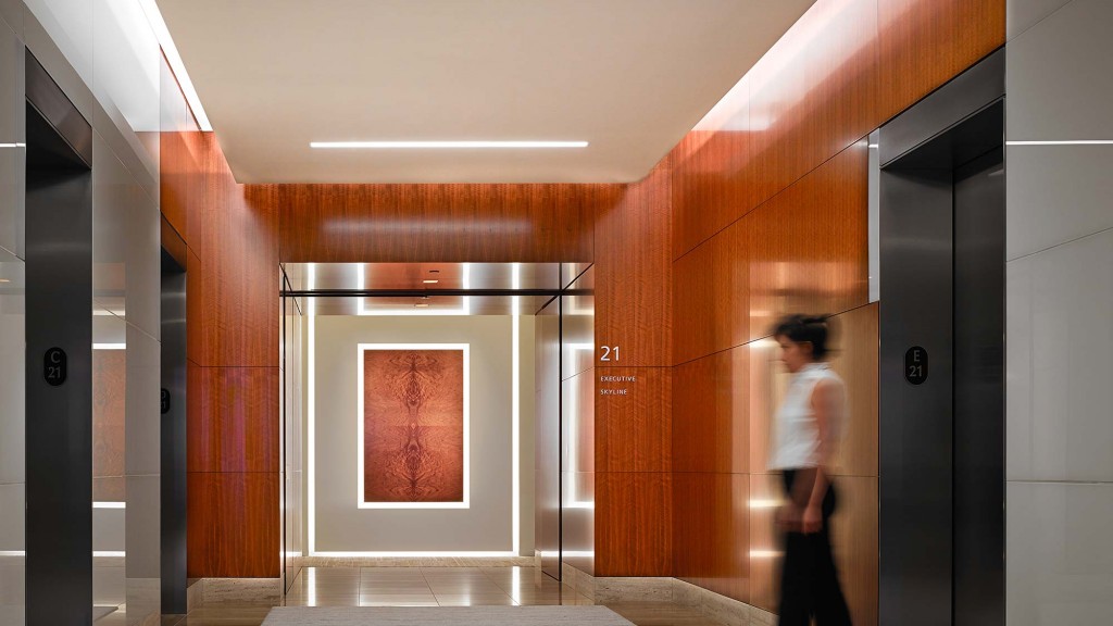 A person walking through a hallway.
