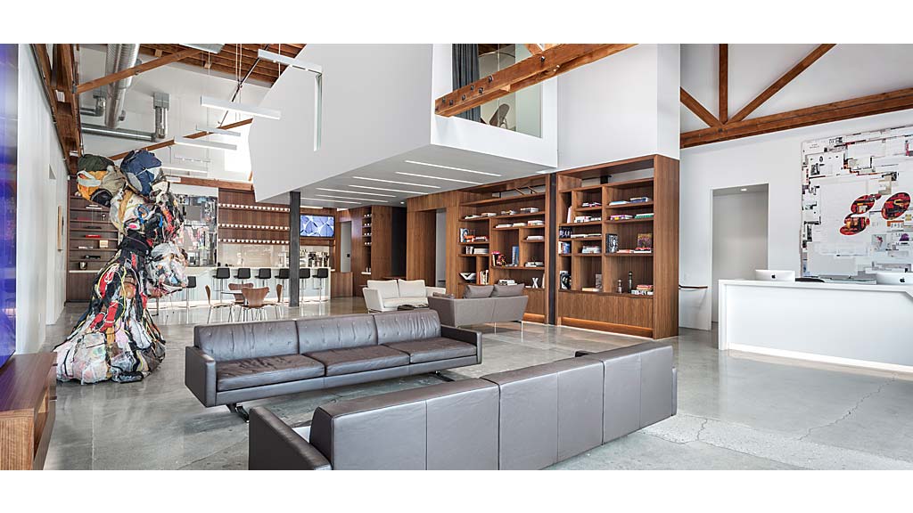 A room with a couch and shelves.