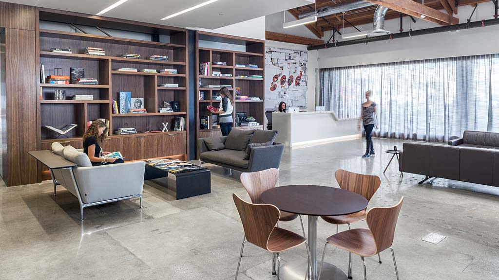 A room with a table chairs and a couch.