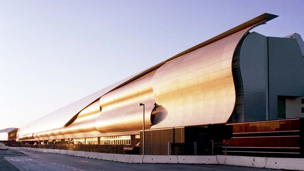 A large building with a curved roof.