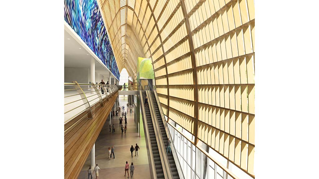 A group of people walking on a train platform.