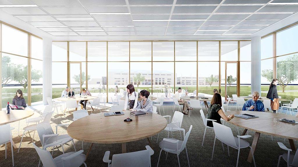 A group of people sitting at tables.