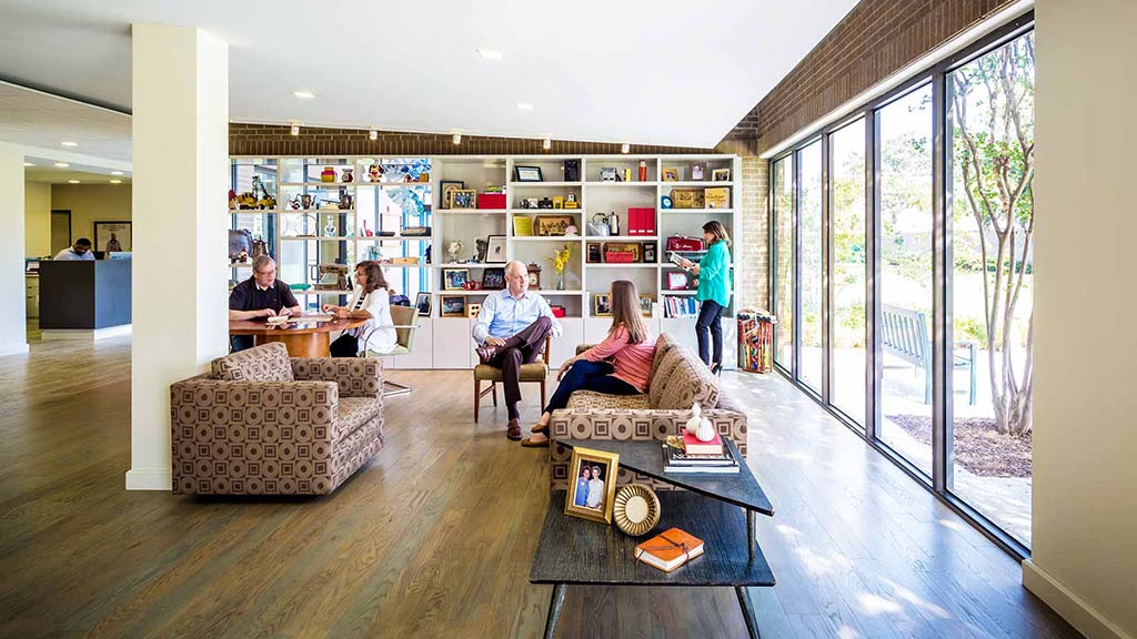 A group of people in a library.