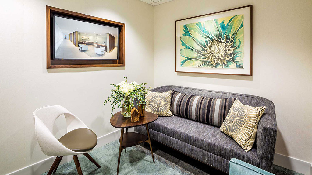 A living room with a couch and a table.