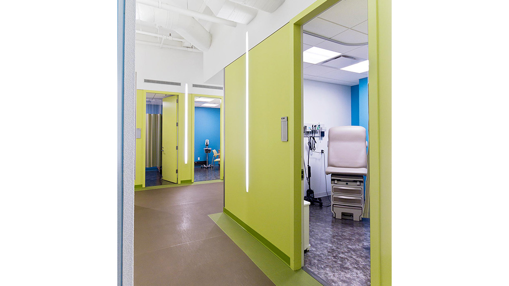 A hallway with a white machine.