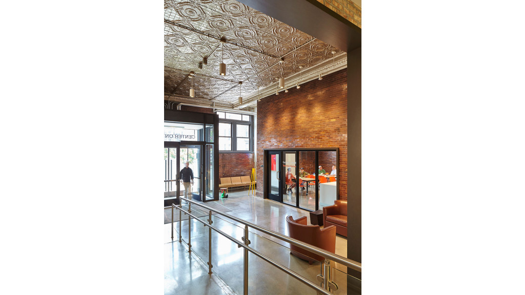 A person walking out of a building.