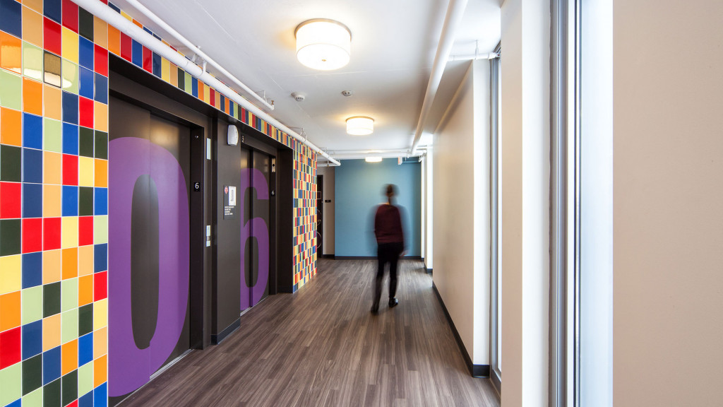 A person walking down a hallway.