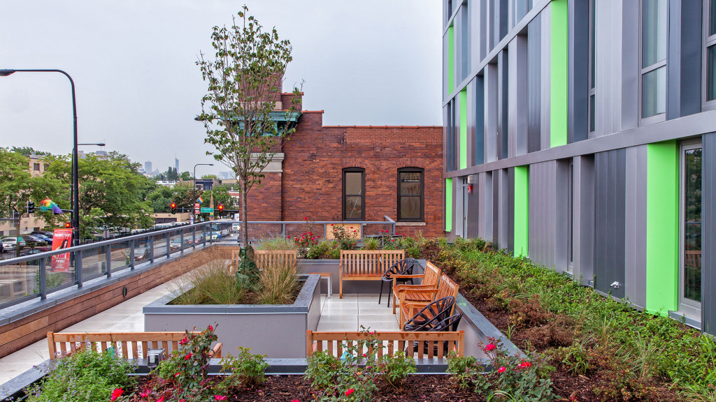 A building with a bench and tables.