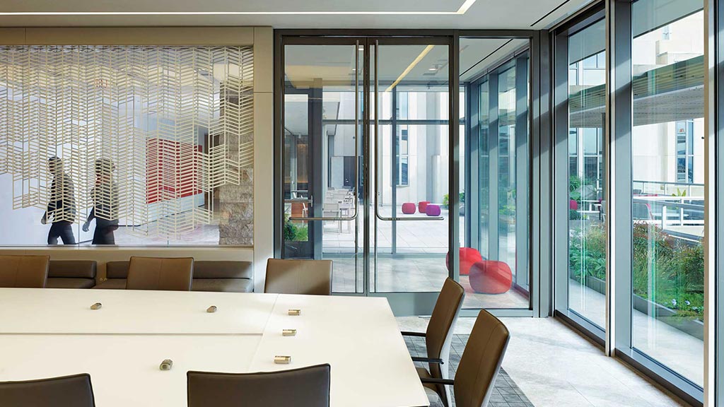 A room with a table and chairs.