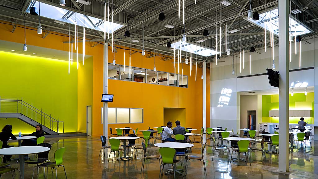A group of people sitting at tables.