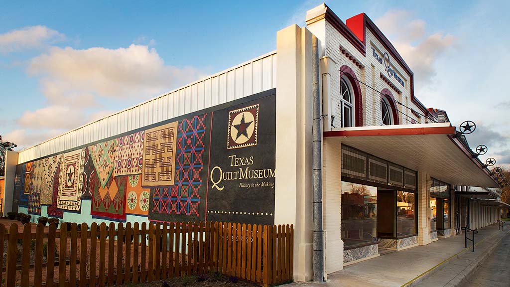 A building with a fence in front.