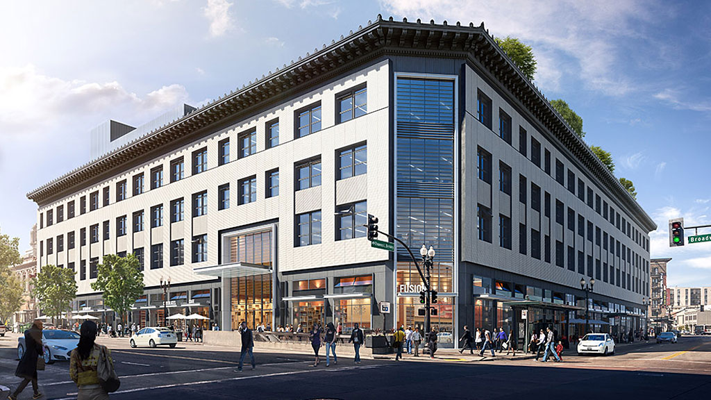 A large building with people walking around.