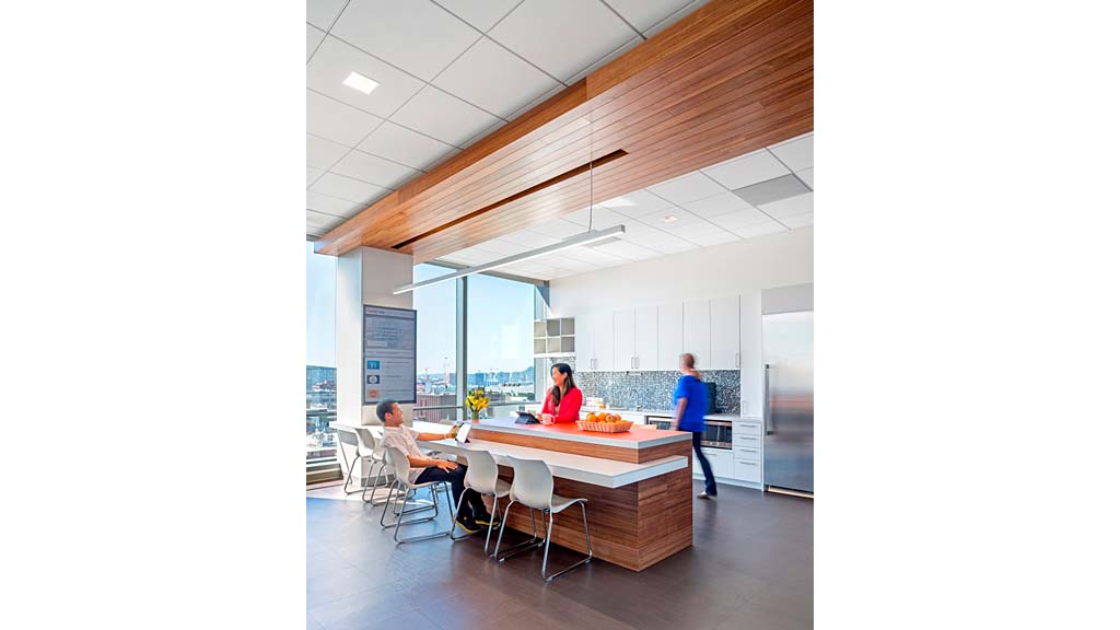 A group of people in a kitchen.