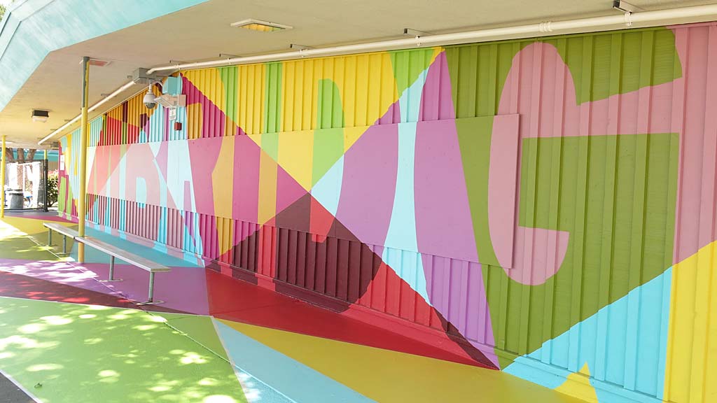 A colorful wall with a blue and yellow stripe.