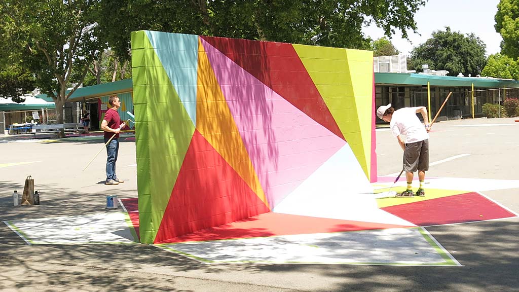 A group of people playing in a park.