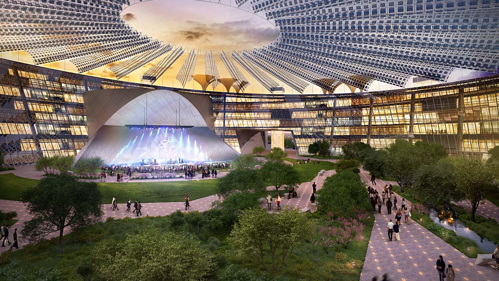 A large building with a large glass dome and a fountain in the middle.