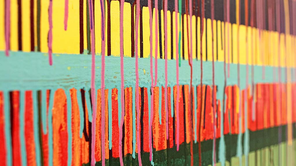 A group of rainbow colored pencils.