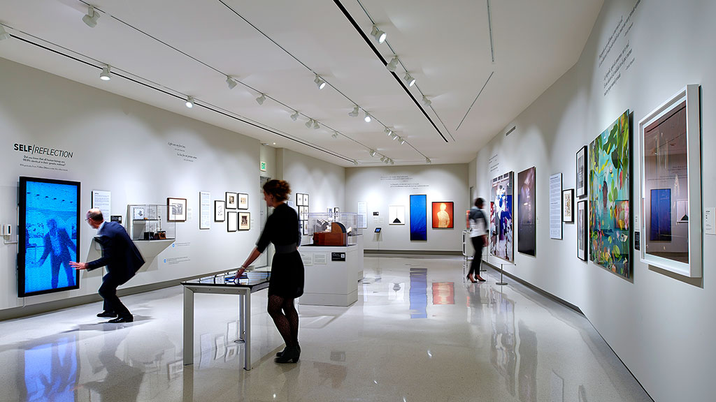 People walking in a museum.