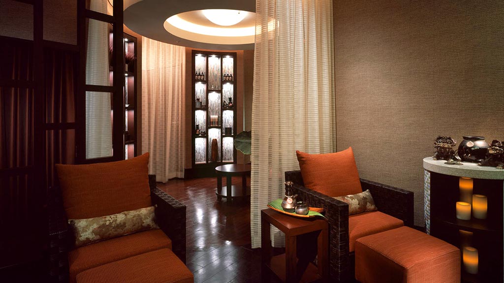 A living room with a couch and a table.