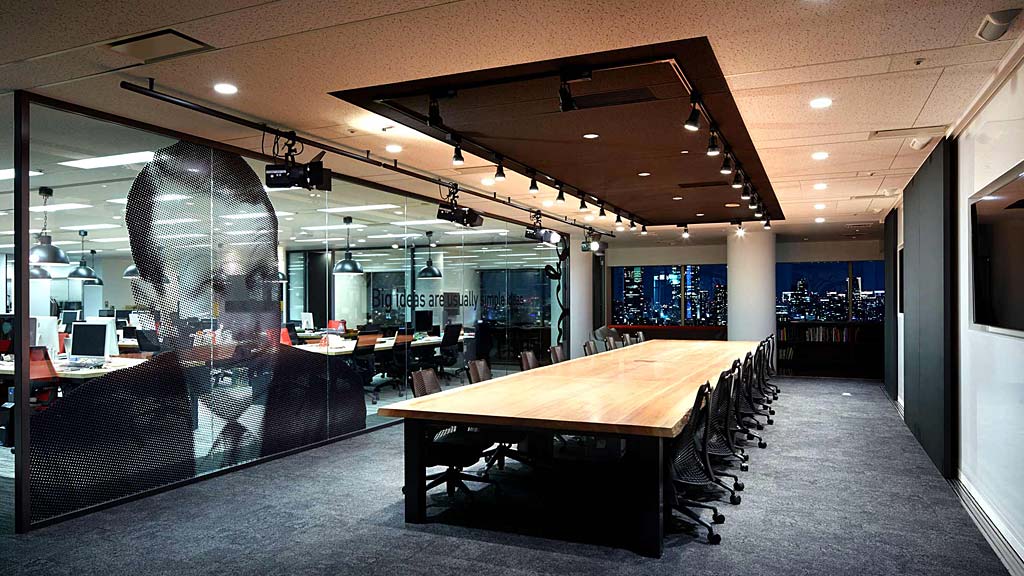 A room with a table and chairs.