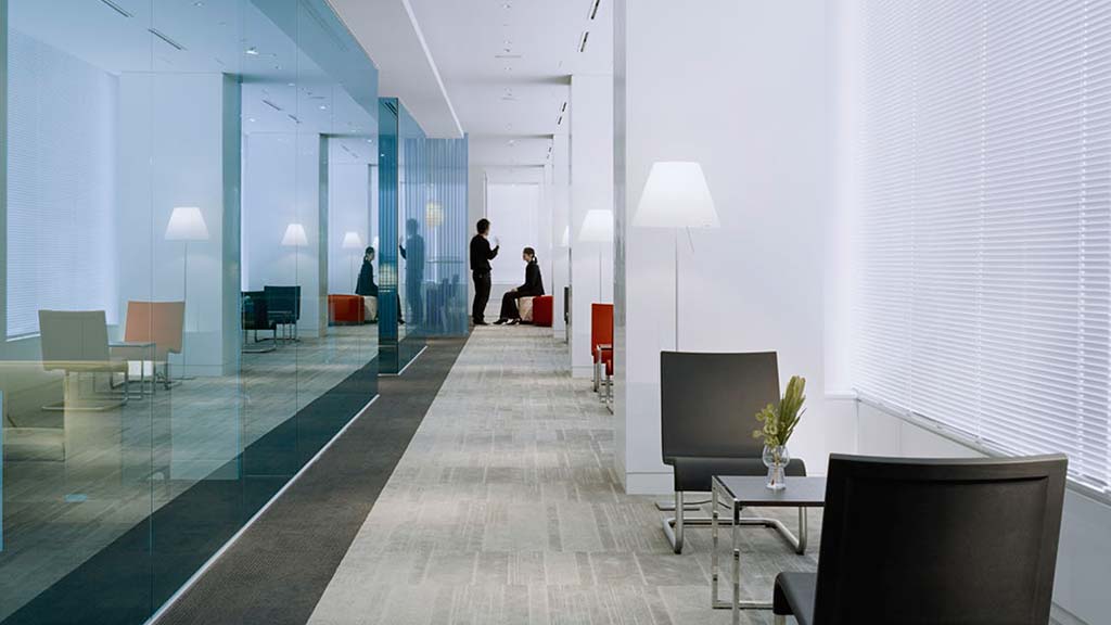 A long hallway with a glass wall.