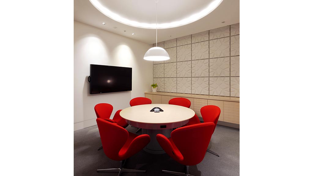 A room with a table and chairs.