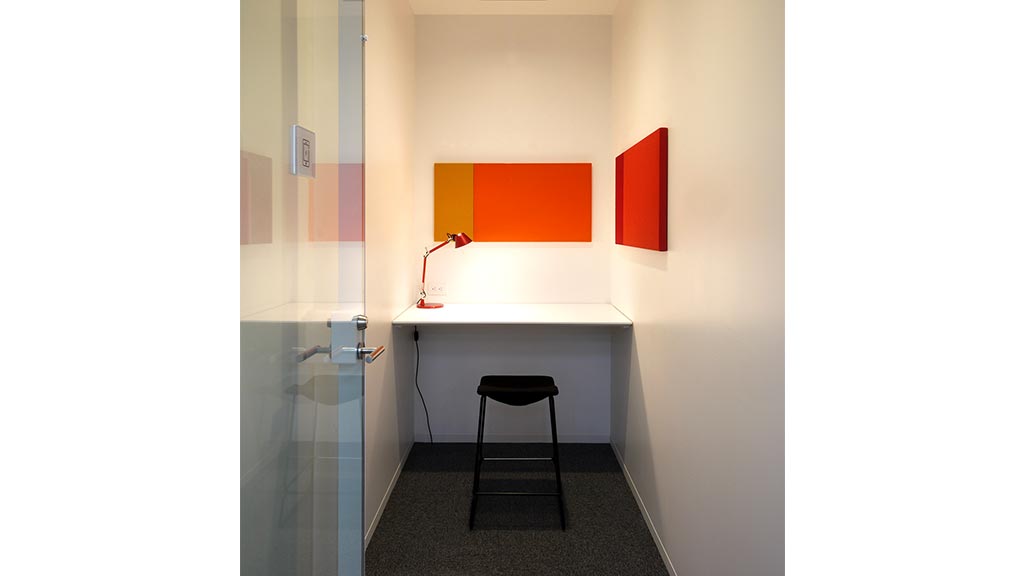 A room with a desk and a chair.