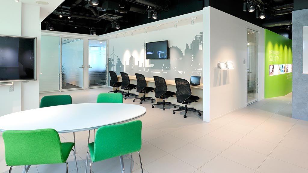 A room with a table and chairs.