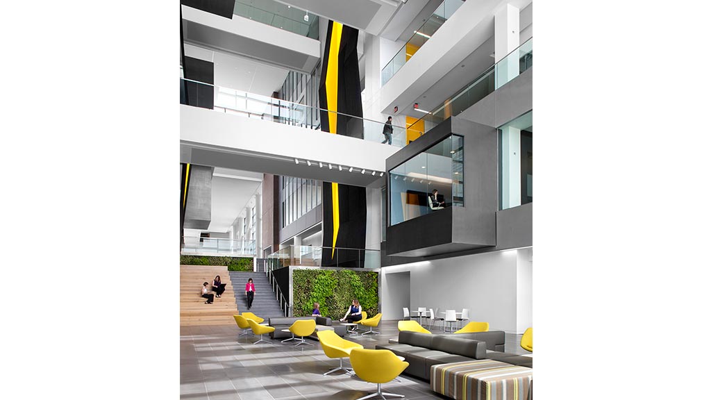 A building with a few people and a few chairs.